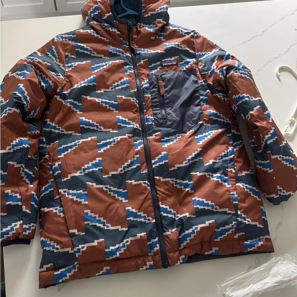Patagonia Blue and Brown Puffer Jacket with Geometric Design